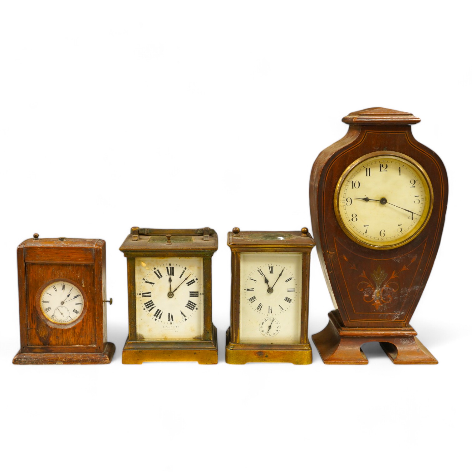 Two carriage clock, an Edwardian mantel clock, 25cm high, and a watch mounted in an oak case (4). Condition - fair, not tested for working